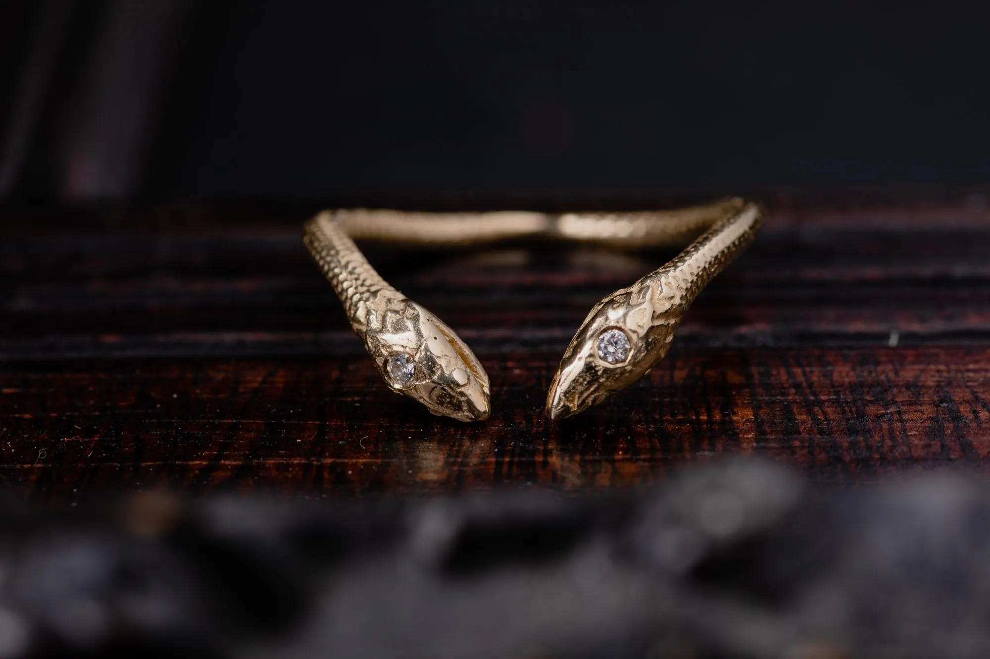 An image of a Double Snake 14K Gold Ring With Diamonds, handcrafted by Marren Jewelry studio in Greece.