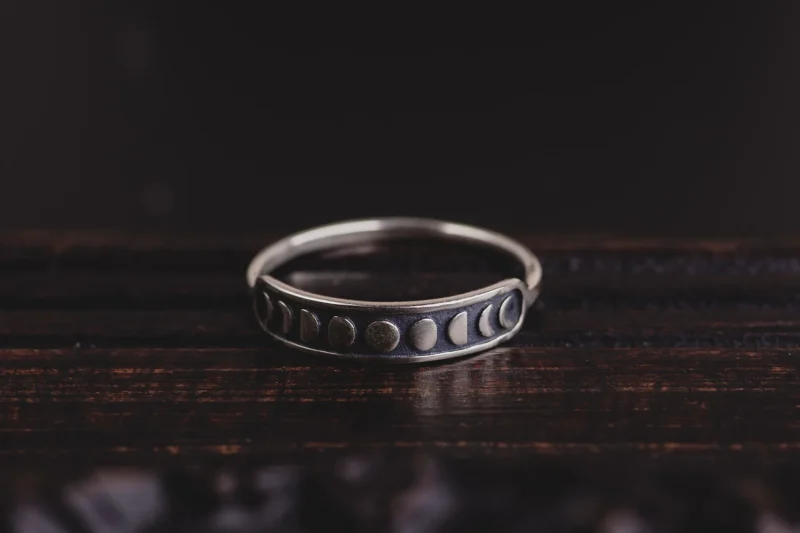 A photo of a Moon Phases Sterling Silver Ring, handcrafted by Marren Jewelry in Greece.