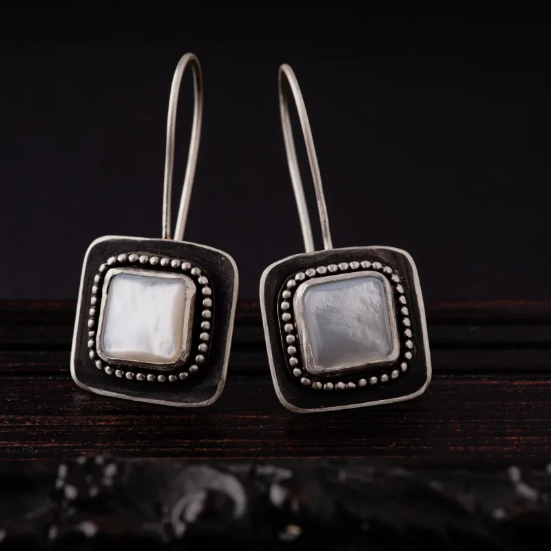 An image of Mother of Pearl Sterling Silver Earrings, handcrafted by Marren Jewelry studio in Greece.