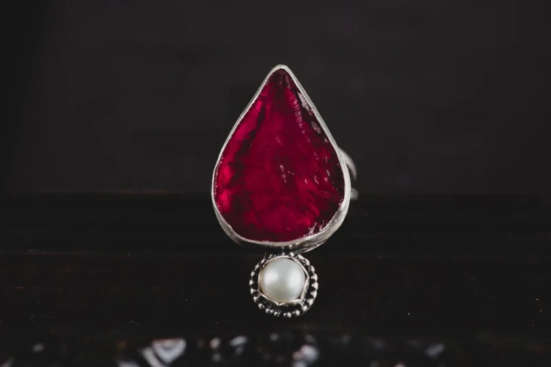 An image of a Ruby and Pearl Sterling Silver Ring, handcrafted by Marren Jewelry in Greece.