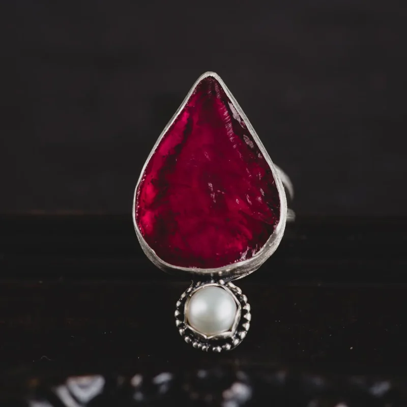 An image of a Ruby and Pearl Sterling Silver Ring, handcrafted by Marren Jewelry in Greece.