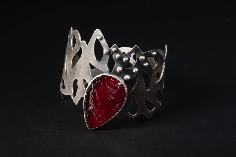 An image of a Ruby Cuff Sterling Silver Bracelet, handcrafted in Greece by Marren jewelry studio.