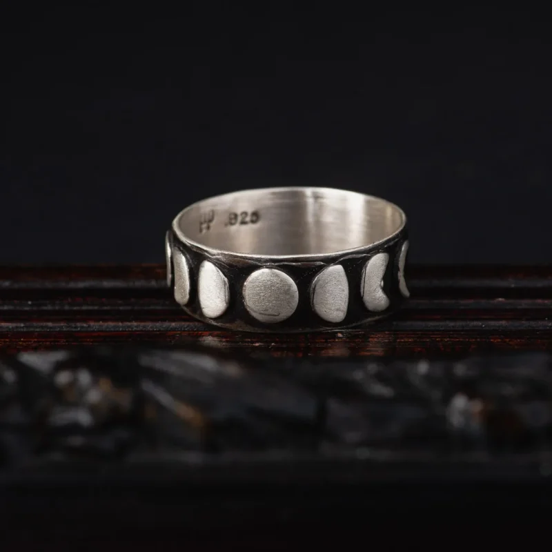 An image showing a Wide Moon Phases Ring, handcrafted in Greece by Marren Jewelry studio.