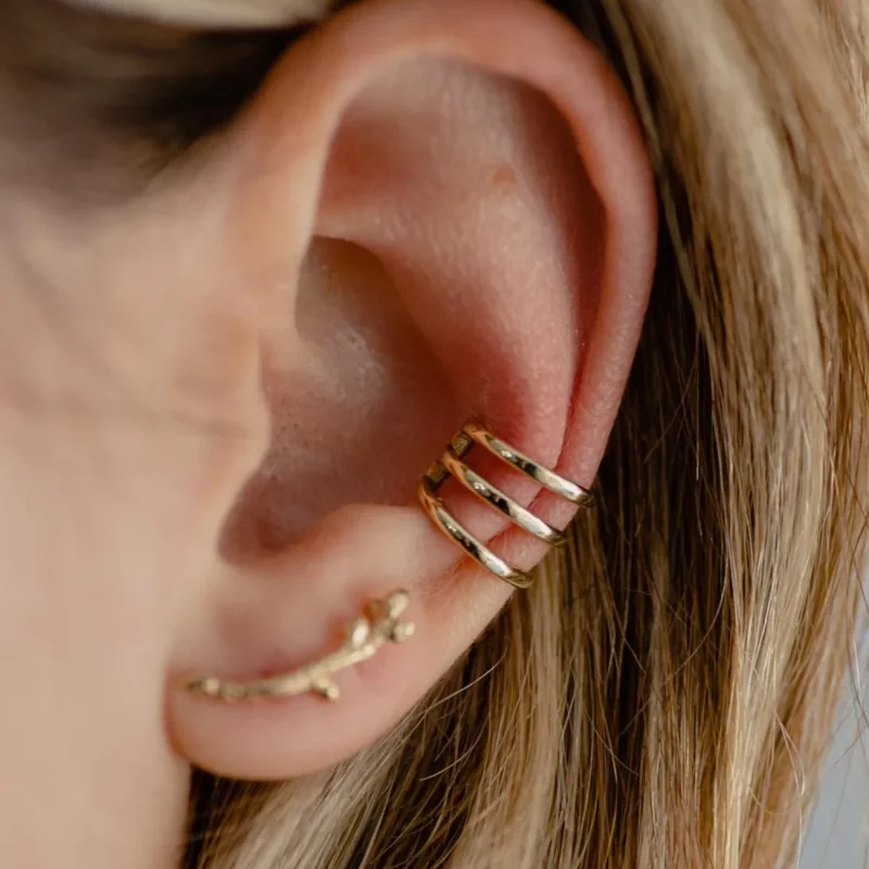 A photo of a 14K Gold Ear Cuff, handcrafted by Marren Jewelry in Greece