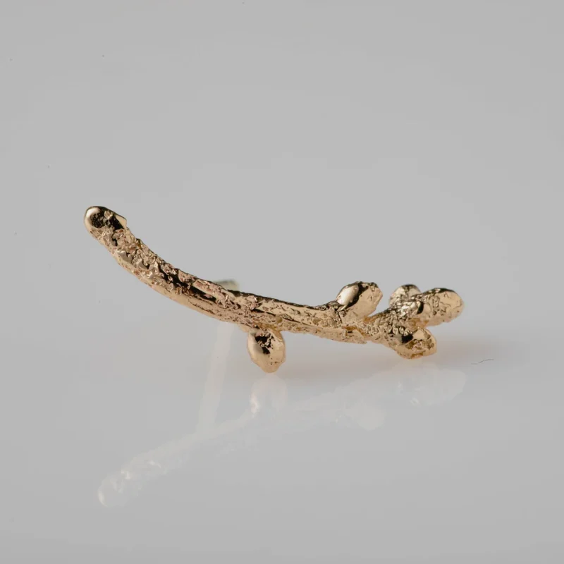 An image showing a 14K Gold Twig Ear Climber. It is handcrafted at Marren Jewelry studio in Greece.