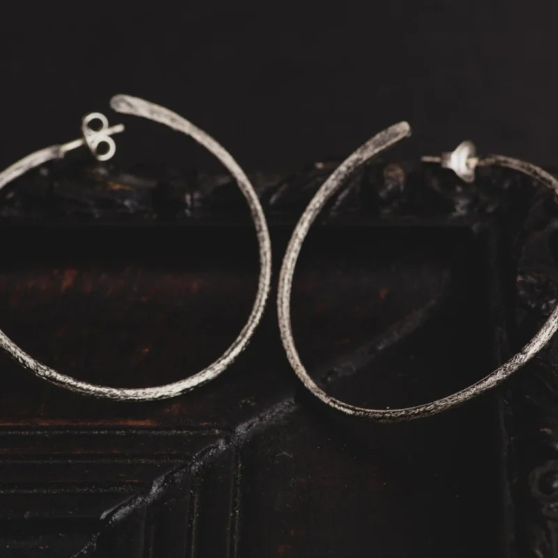 An image showing a pair of Sterling Silver Large Hoop Earrings, handcrafted by Marren Jewelry in Greece.