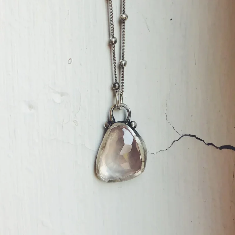 An image of a Rose Quartz Sterling Silver Pendant, handcrafted by Marren Jewelry studio in Greece
