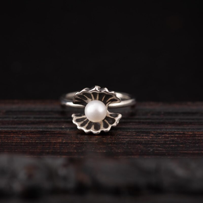 An image showing a Oyster and Pearl Sterling Silver Ring, handcrafted by Marren Jewelry in Greece.