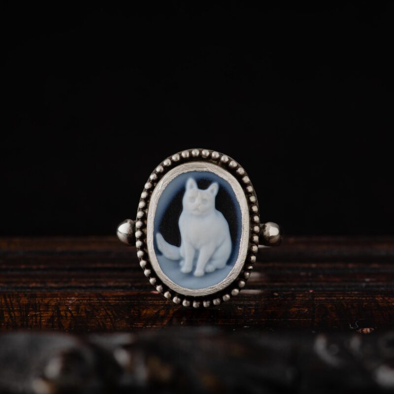 A close-up photo of a Cat Cameo Sterling Silver Ring with granulation, handcrafted by Marren Jewelry in Greece