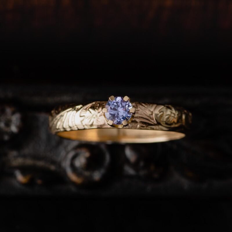 An image of a 14K Gold Purple Tanzanite Ring with Floral Band, handcrafted by Marren Jewelry studio in Greece