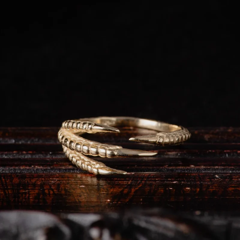 An image showing a 14K solid gold talon ring