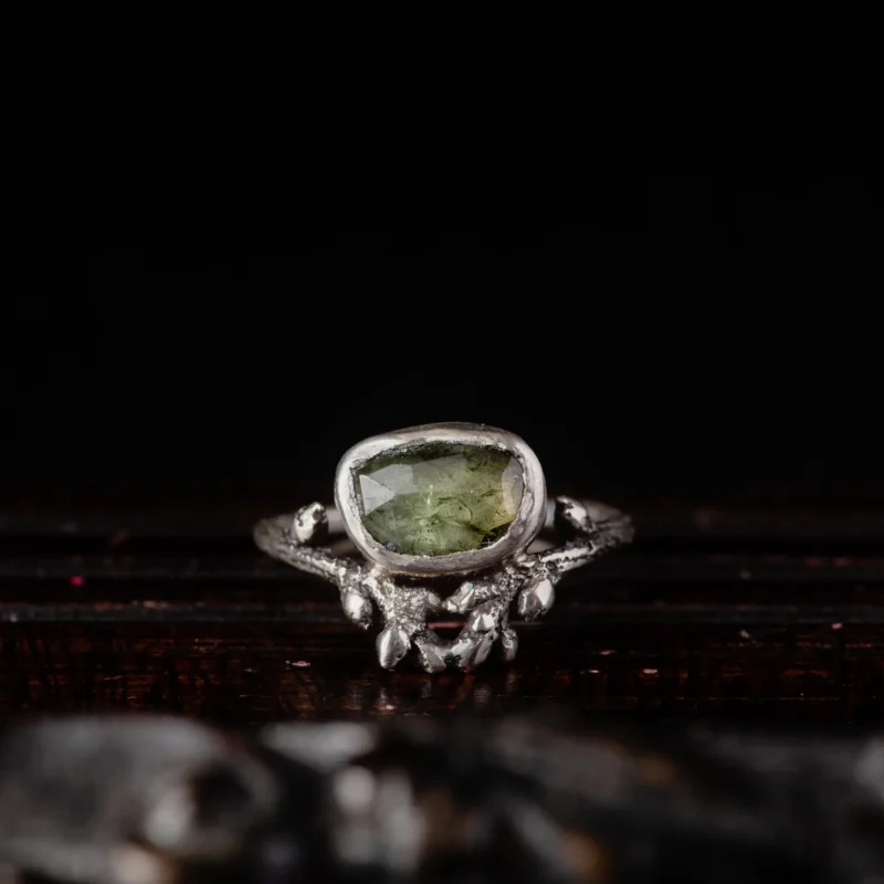 An image showing a green tourmaline twig ring in sterling silver