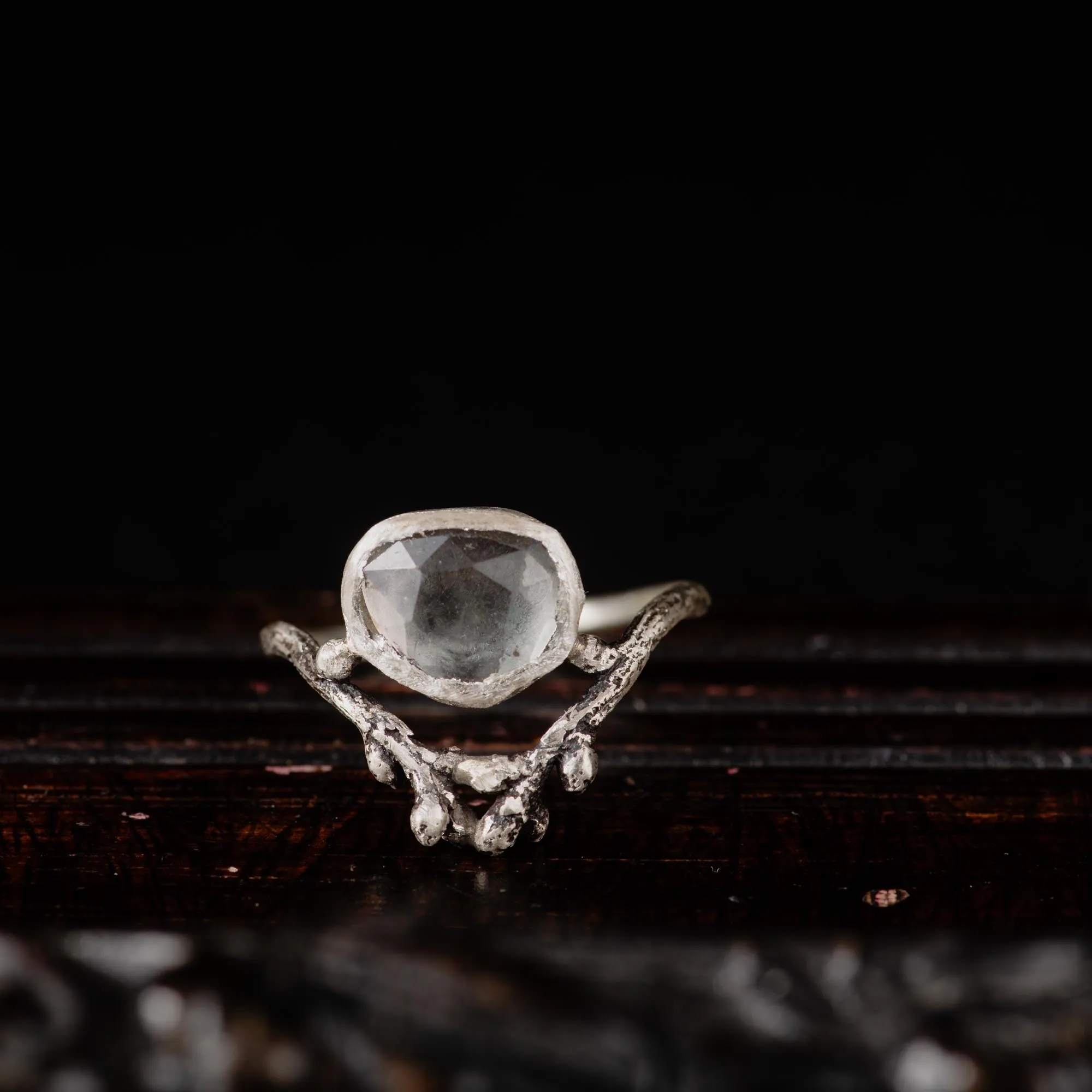 An image showing a subtle grey tourmaline sterling silver twig ring