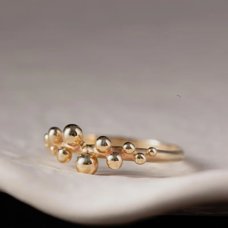 An image showing a 14K gold ring with tiny bubbles on top