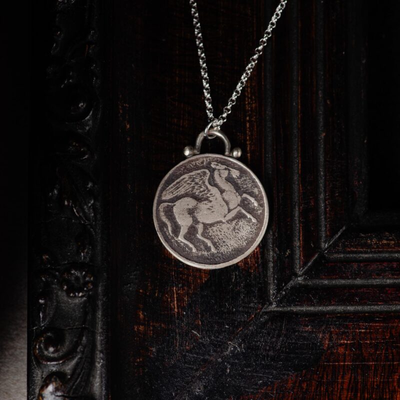 An image showing a pegasus sterling silver coin pendant
