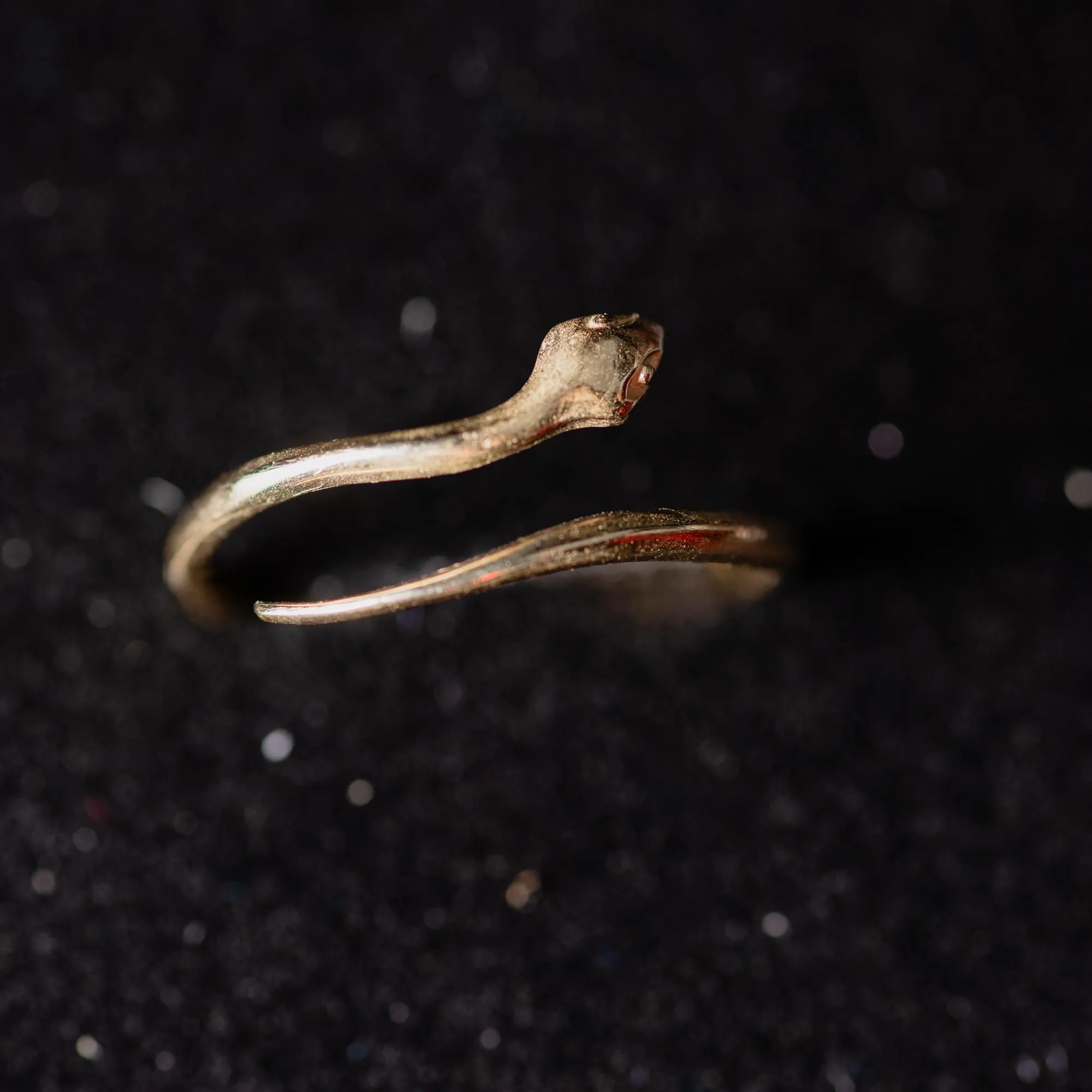 An image showing a 14K yellow gold snake adjustable ring