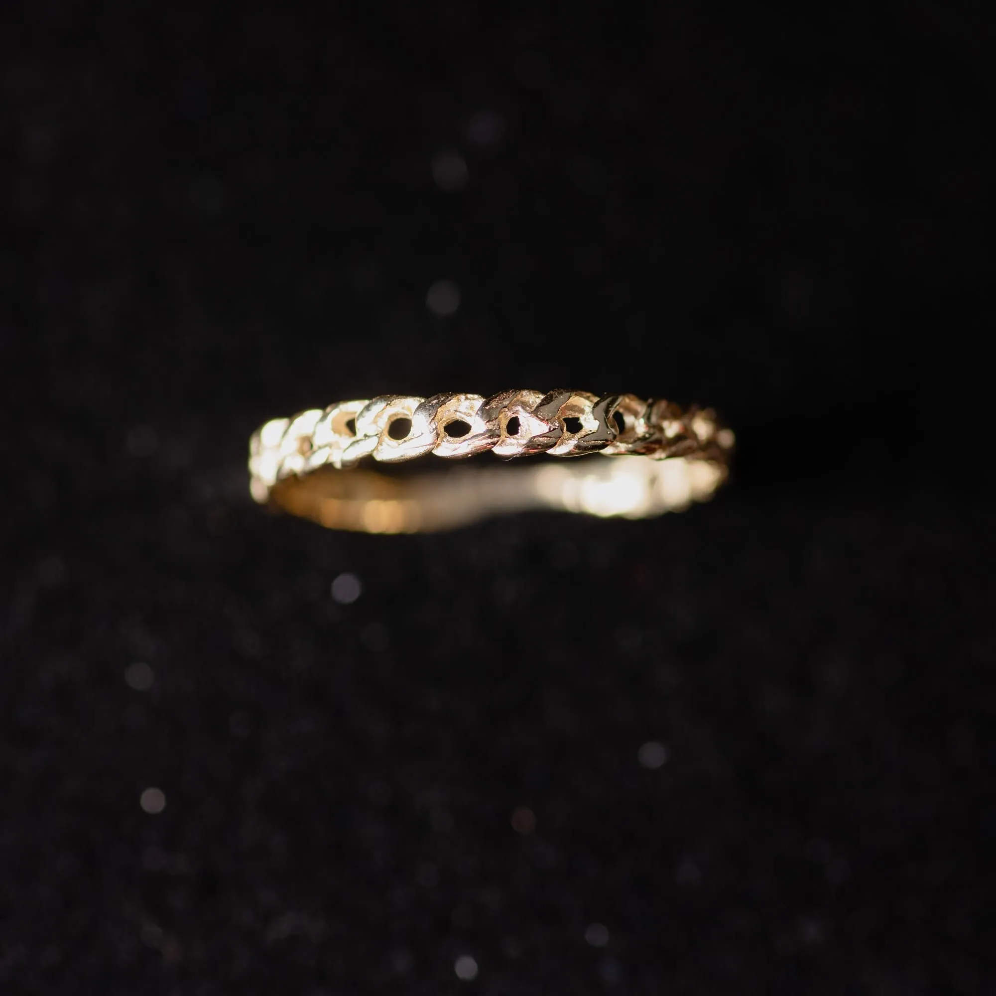 An image showing a 14K gold delicate chain ring in details