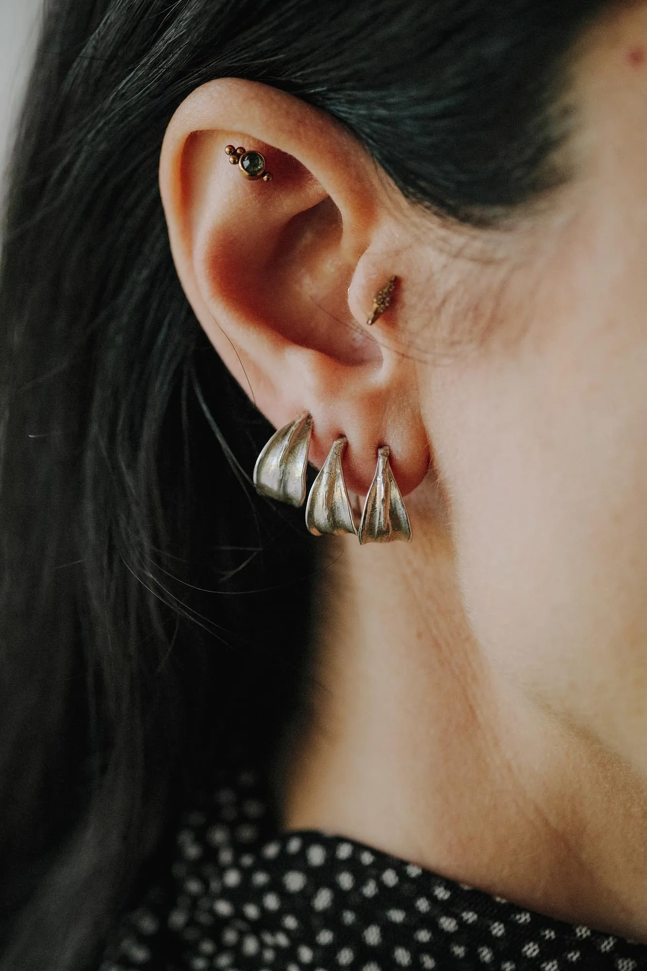 An image showing 3 sterling silver huggies hoops